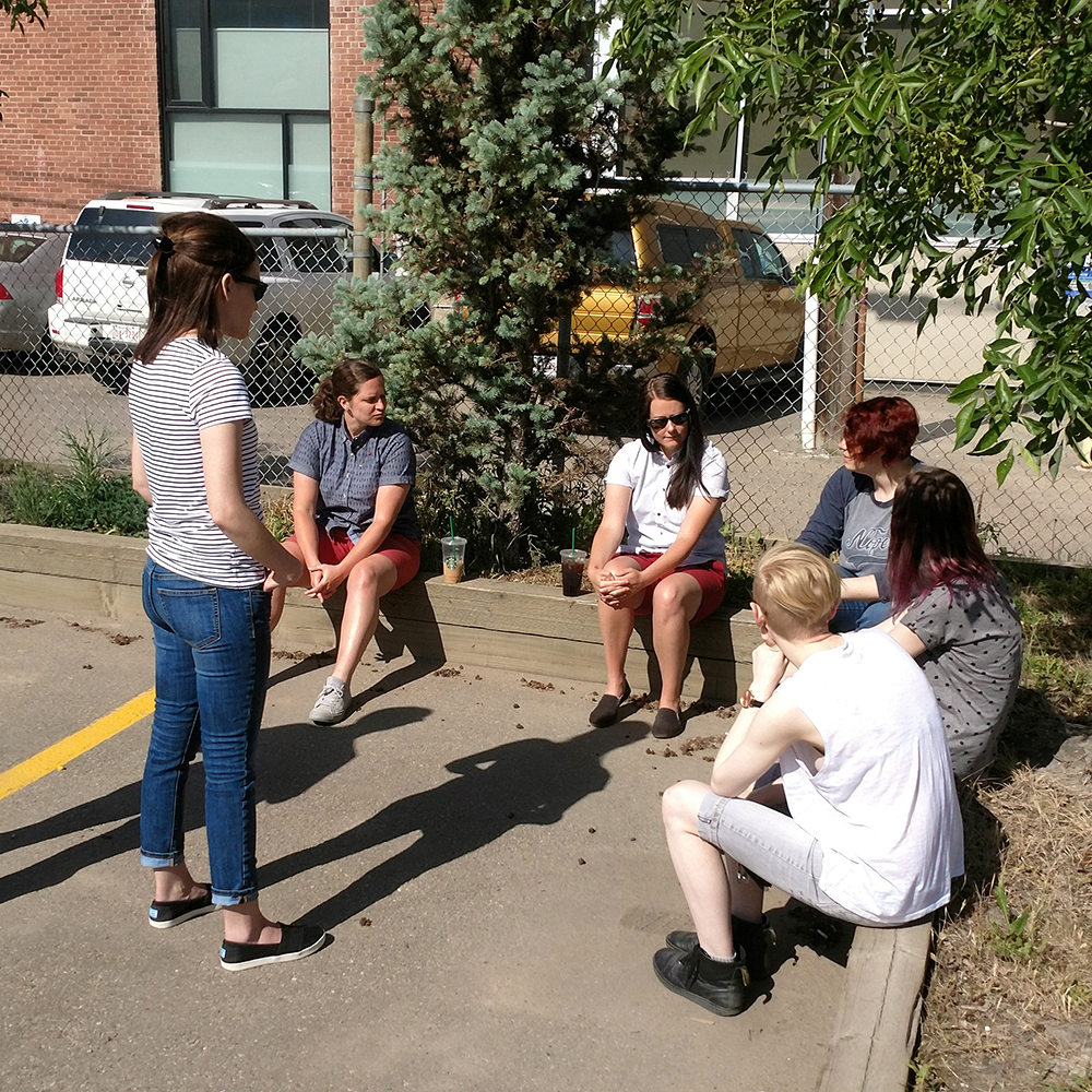 Kick Point having a meeting in the Healy Ford parking lot in downtown Edmonton, Summer