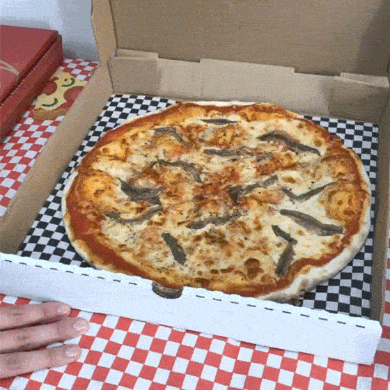 Artisti pizza box opening to show a large pizza