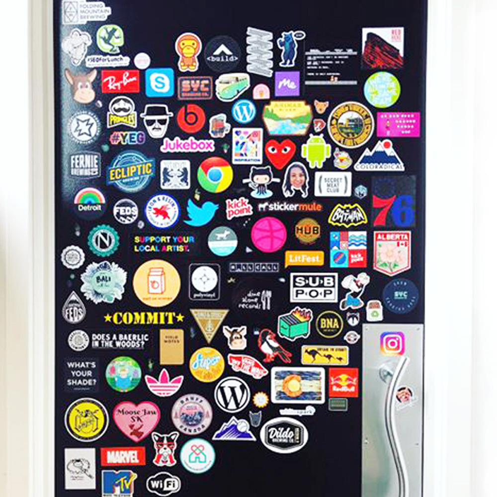 Various coloured stickers on a black door