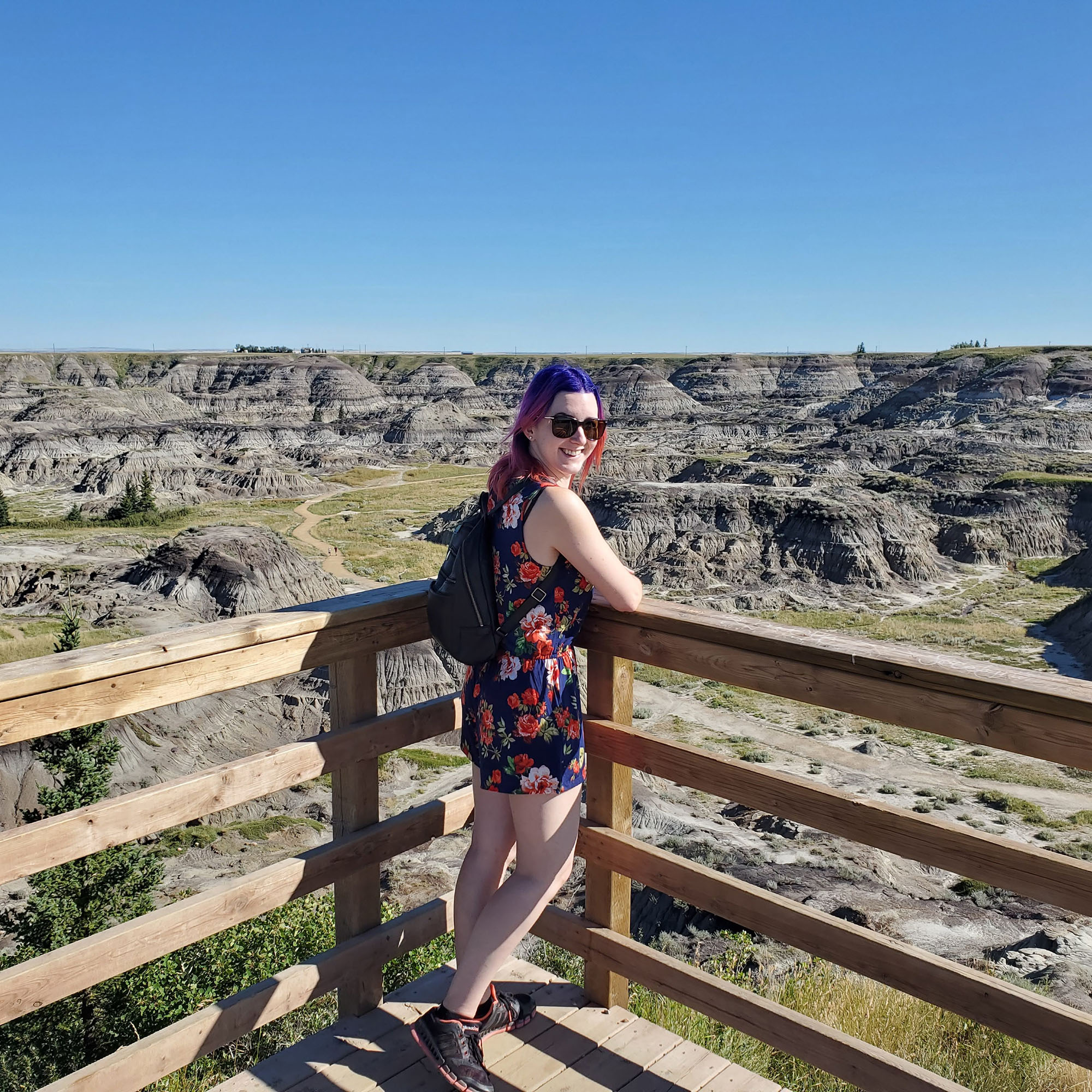 Brittany poses in front of Drumheller's badlands