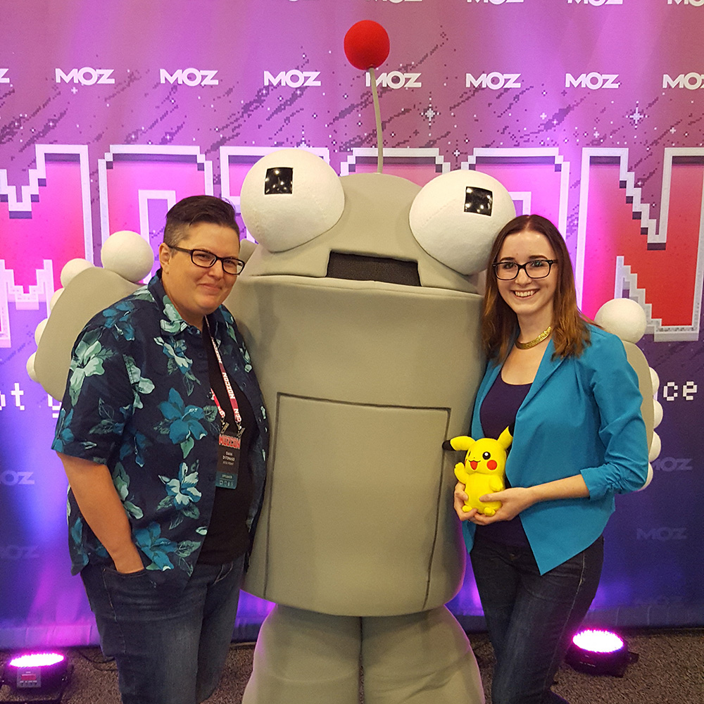 Dana DiTomaso, Brittany Zerr, and Roger the Moz Robot at MozCon 2016