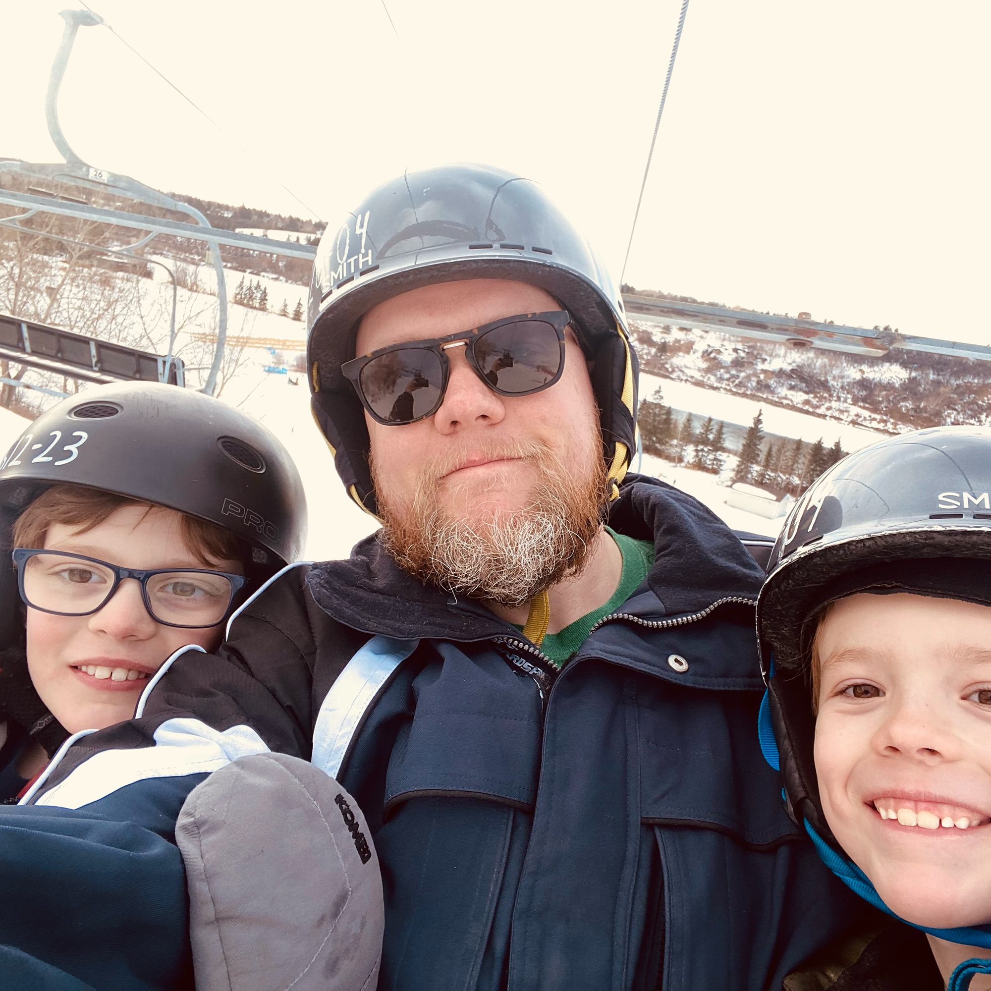 Selfie of Jeff on a ski hill with his two sons