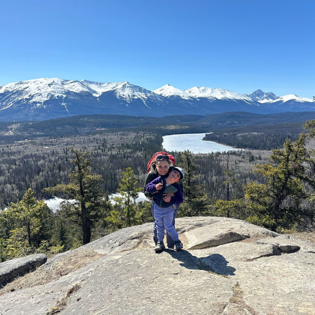 Amy and her daughter on a mountain